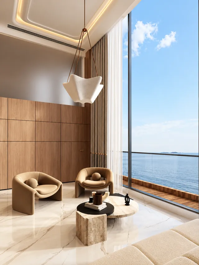 Double-height lounge with an open view of the sea